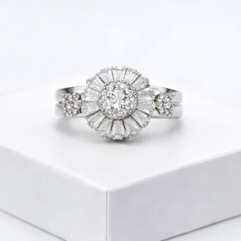 Make a statement with this premium ring. Adorned with a brilliant sunburst cluster of baguette and round crystals, it radiates luxury and everyday glamour.